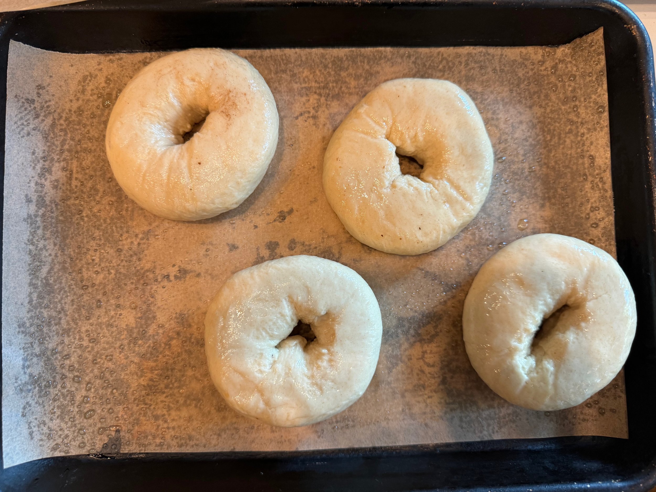 Lye-soaked bagels ready for baking.